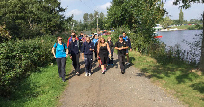 Group of PGCE Secondary Physical Education students walking on riverside walkway