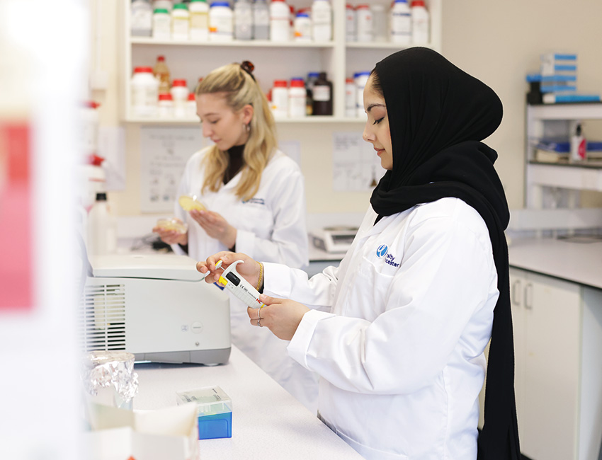 Two students working in a lab
