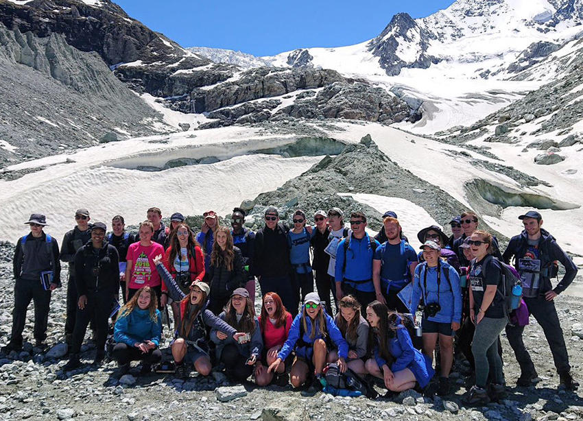 Geography students with the Swiss Alps in the background