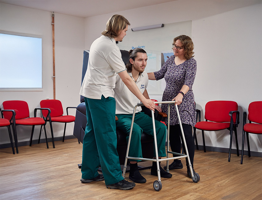 Two students engaging in a practical Occupational Therapy session