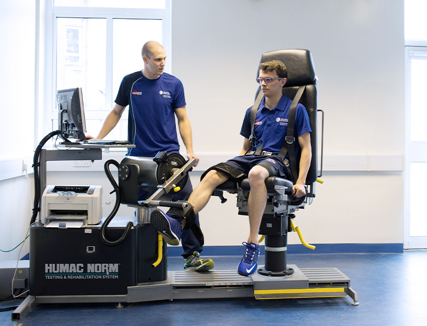 A lecturer and sports student using rehabilitation equipment