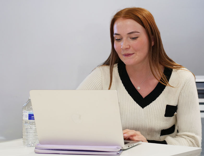 student working on a laptop