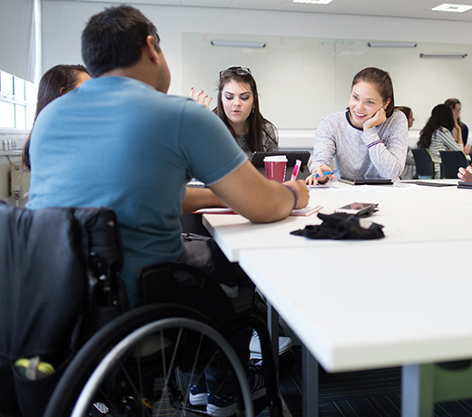 A group of students chatting in a seminar