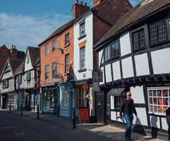 A shot of the outside of independent shops in Tudor buildings in the Shambles road.