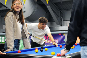 Students playing pool in the Hangar