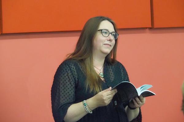 woman who is holding an open book