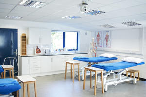 inside a mock hospital ward with two beds