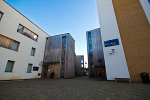view of two campus buildings from the ground