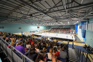 view from the back row of spectators looking towards a sports court
