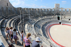 students on the steps of a circular stadium