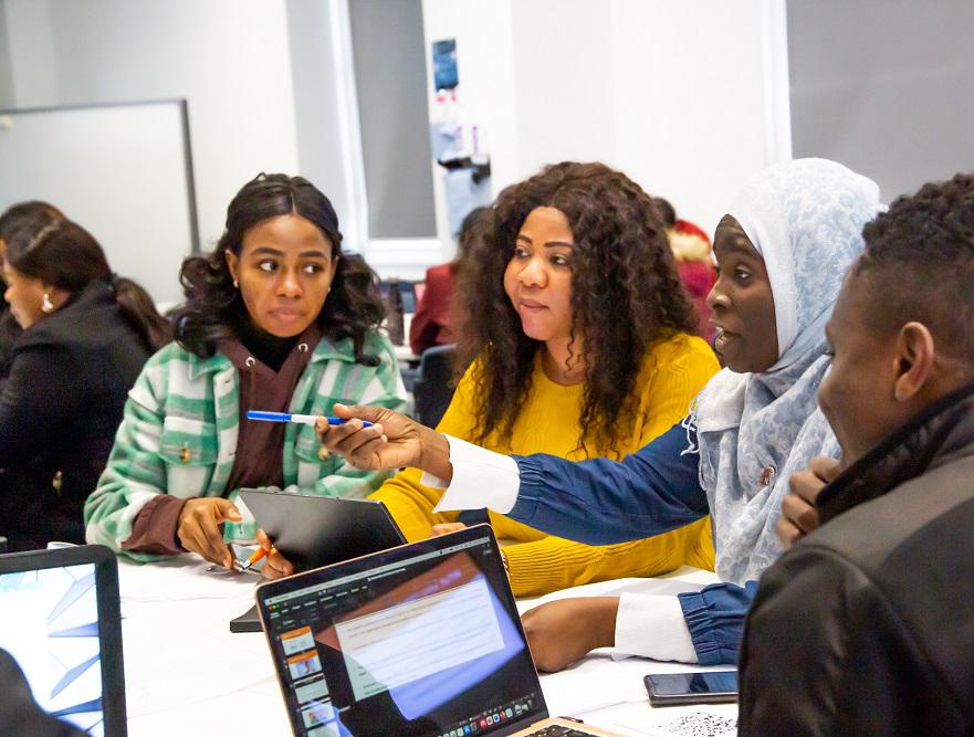 students debating around a table