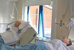 Hospital beds in a clinical skills room used for paramedic training on our paramedic science degree.