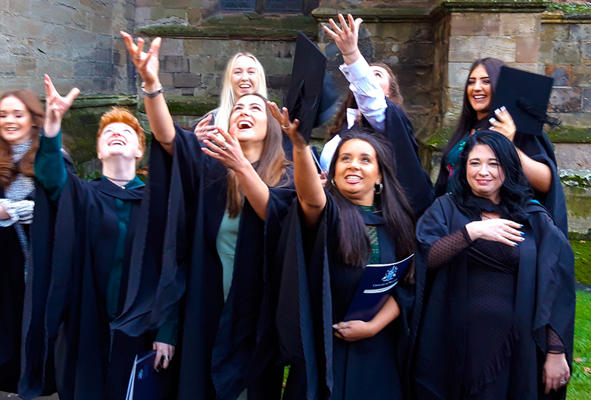 Special Educational Needs, Disabilities and Inclusion students throwing graduation hats into the air