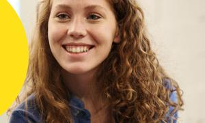 smiling girl with brown wavy hair