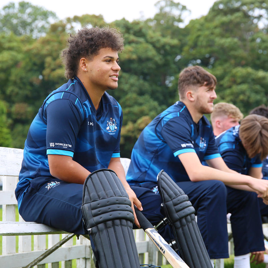 Cricket players on the bench during a match