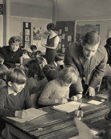Student teachers in a busy classroom in the 1950s