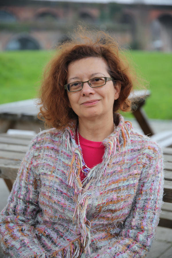 Person facing camera with landscape behind