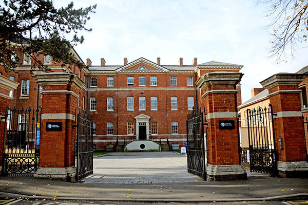 Shot of Charles Hastings building by the gates at City Campus