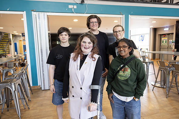 Group of five people in a room