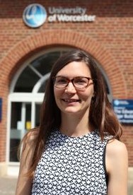 University of Worcester logo on a light blue background