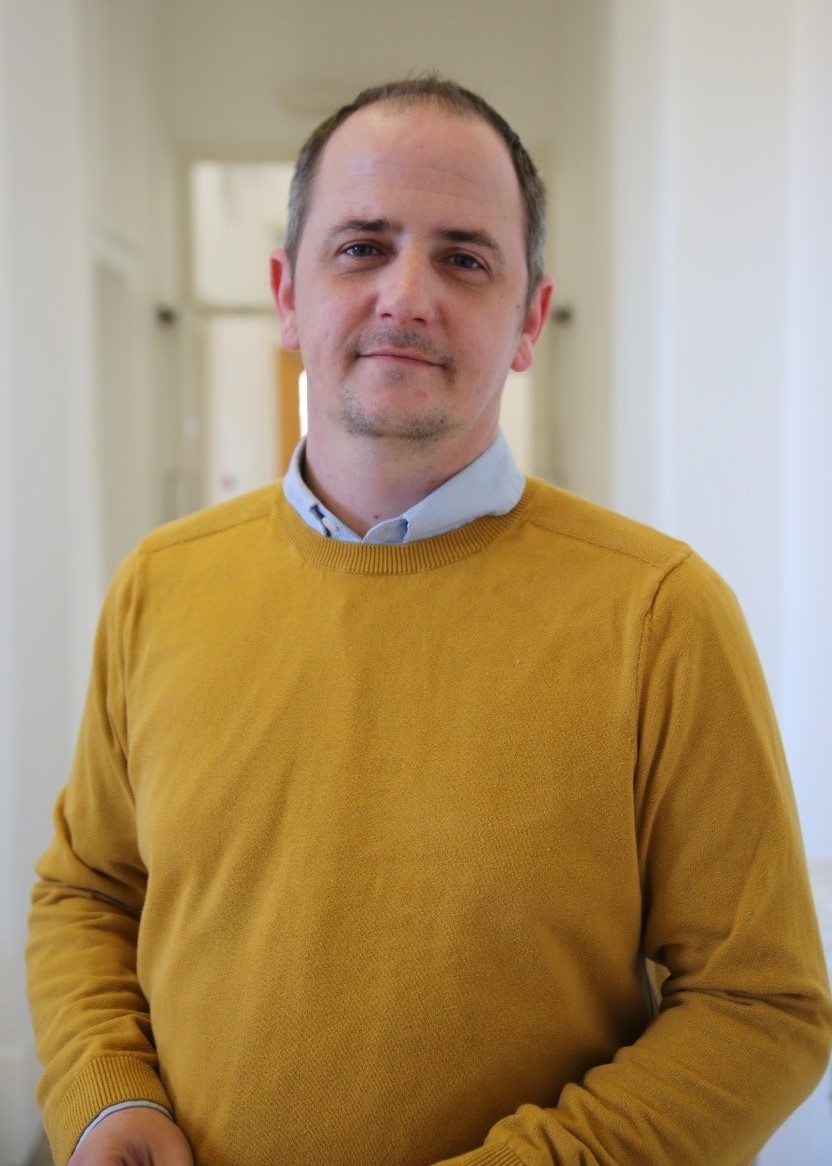 University of Worcester logo on a light blue background