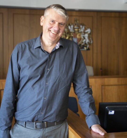 University of Worcester logo on a light blue background