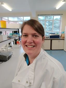 University of Worcester logo on a light blue background