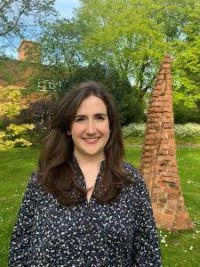 University of Worcester logo on a light blue background