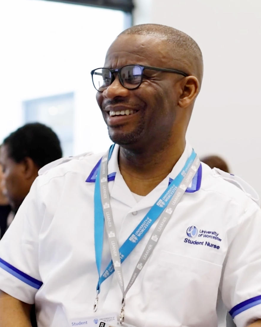 Victor,  a nursing student wearing a white nursing uniform