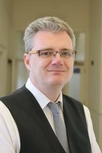 University of Worcester logo on a light blue background