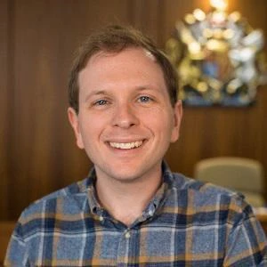 University of Worcester logo on a light blue background