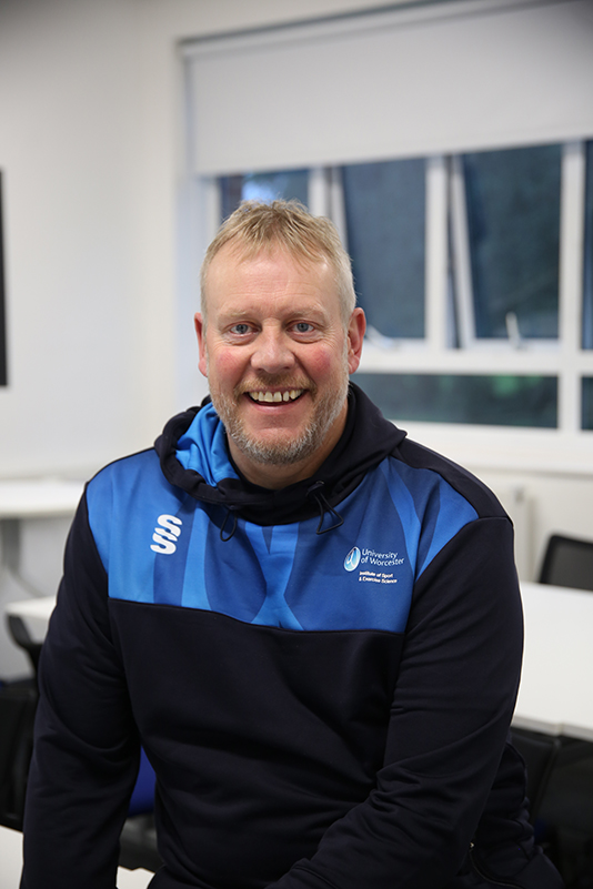 University of Worcester logo on a light blue background