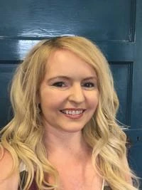 University of Worcester logo on a light blue background