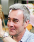 Ian Jones smiling looking into distance