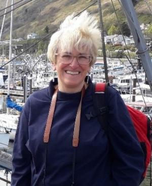 Jane Richardson smiling at camera in boat harbour