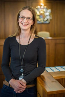 University of Worcester logo on a light blue background