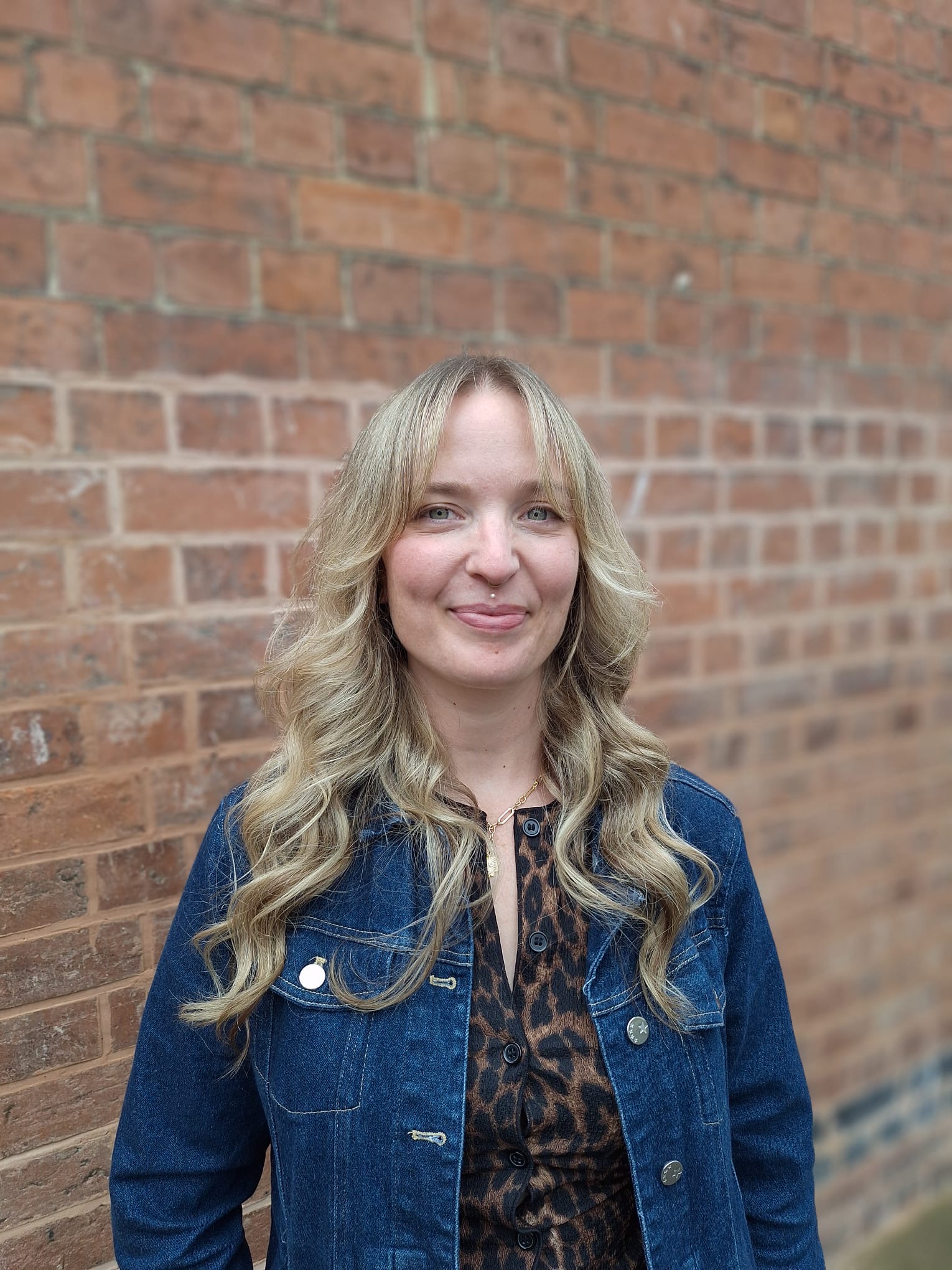 University of Worcester logo on a light blue background