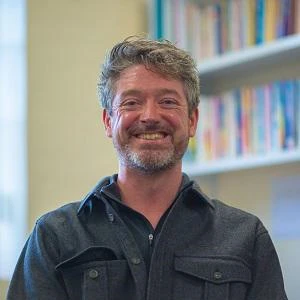 University of Worcester logo on a light blue background