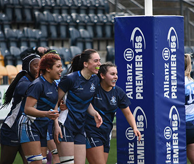 A group of girls playing Varsity Rugby