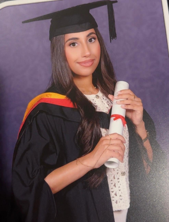 Anisa Bi in her graduation robes