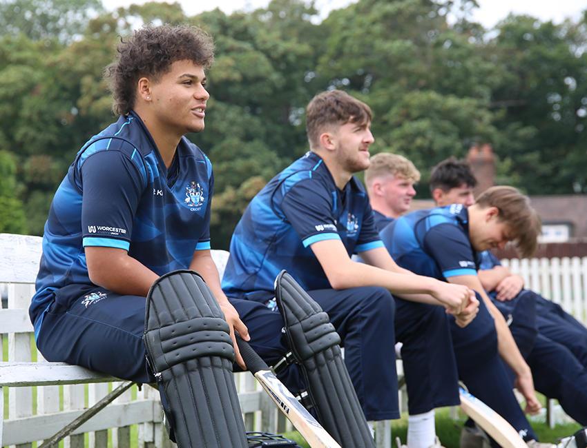 Cricket team sat on the bench