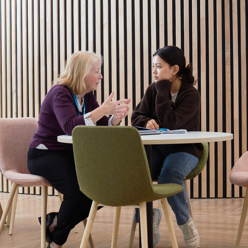 One-to-one with a lecturer and student in a bright modern study space