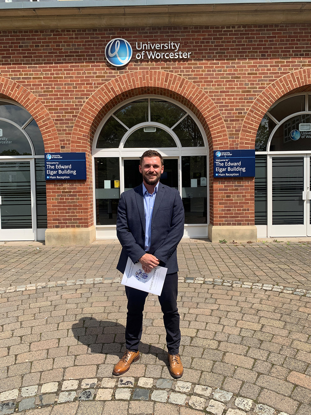 University of Worcester logo on a light blue background