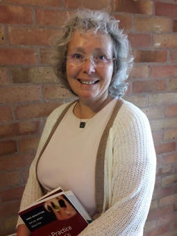 University of Worcester logo on a light blue background