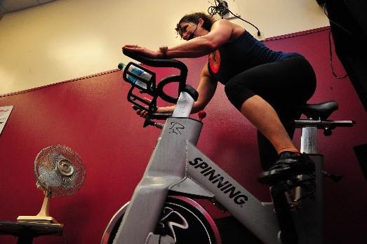 A woman on an exercise bike