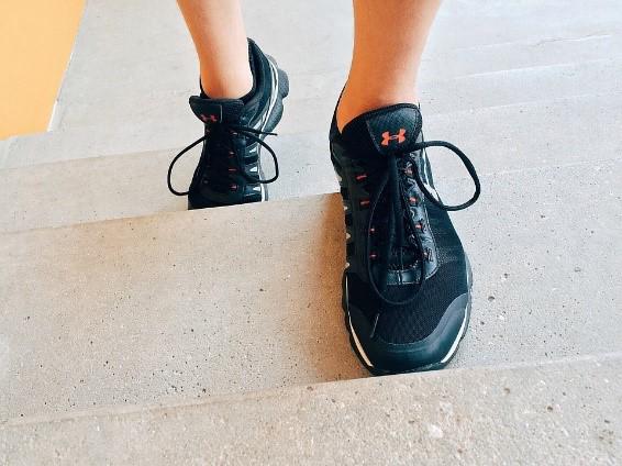 a close up of black running shoes