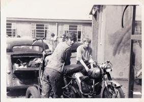 Two men on a motorbike in the 1960s