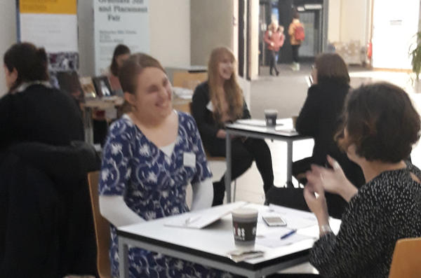 Cath Darwen with literary agent sat at table facing each other