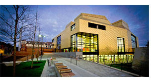 A shot of the Hive Library against a dark blue sky