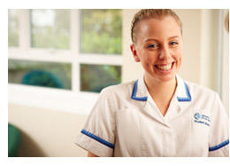 A female Midwifery student smiling